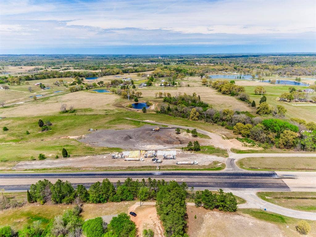 317 Fm 1616, Athens, TX 75752 Expansive acreage featuring open pasture, mature tree clusters, and multiple bodies of water