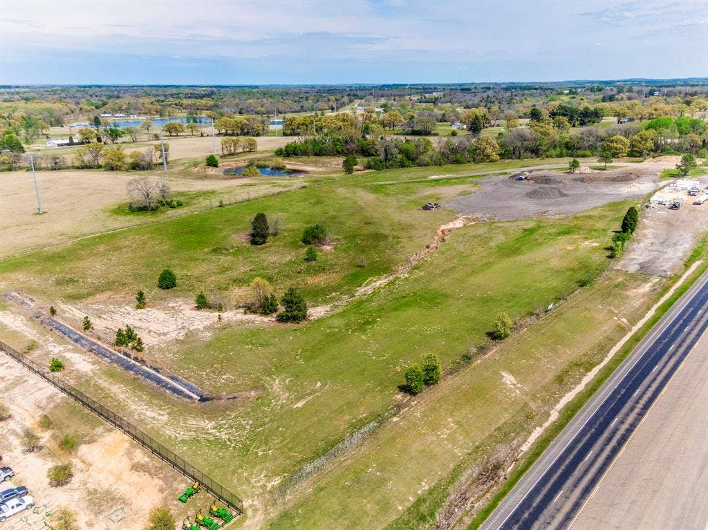 317 Fm 1616, Athens, TX 75752 Expansive acreage featuring cleared topography, native trees, perimeter fencing, and road frontage