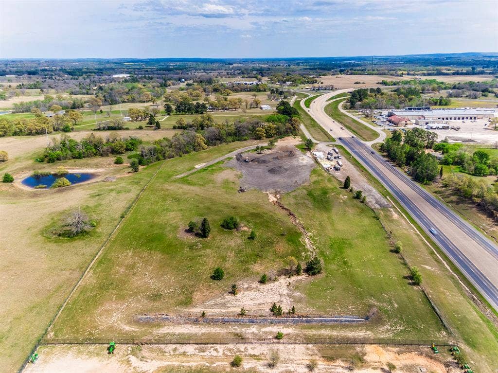 317 Fm 1616, Athens, TX 75752 Expansive parcel featuring open acreage, a natural pond, and mature tree clusters