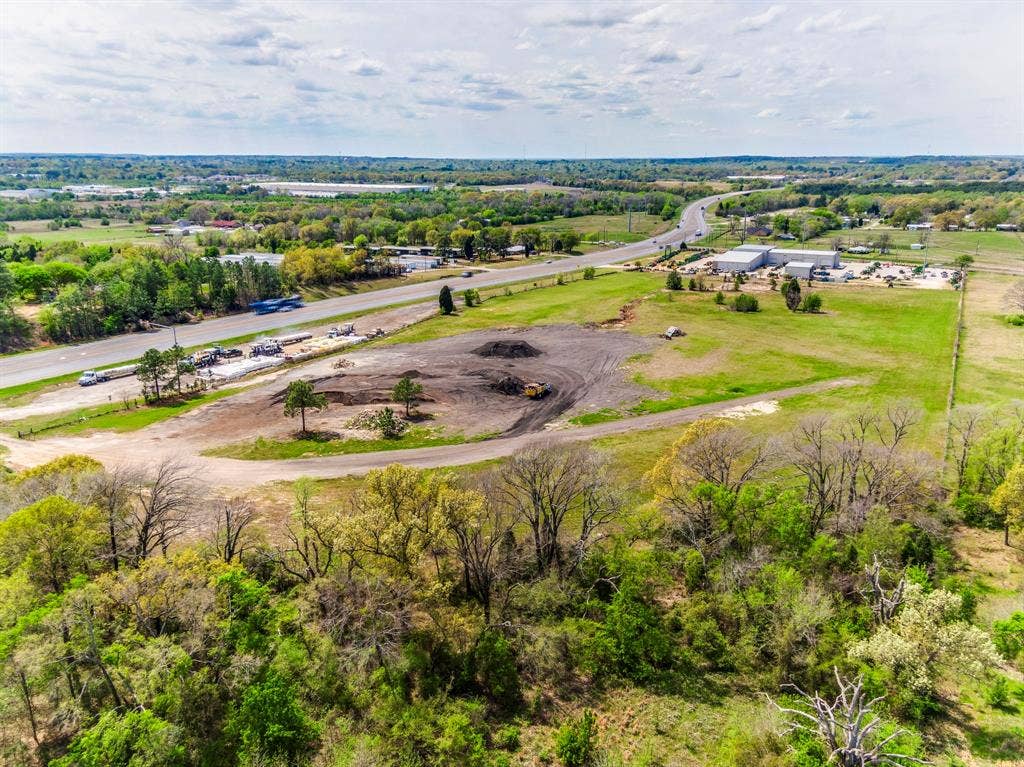 317 Fm 1616, Athens, TX 75752 Expansive acreage featuring cleared land, mature tree lines, and direct road frontage