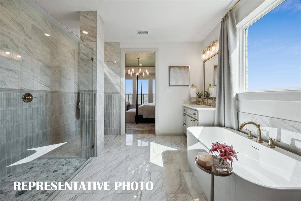4700 Becknell Street, McKinney, TX 75071 Whether it's soaking you cares away in the beautiful tub or indulging a long luxurious shower...this owner's bath is a dream come true! REPRESENTATIVE PHOTO