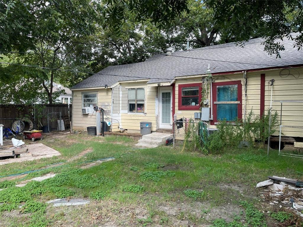 1115 Pine Street, Grand Prairie, TX 75050 Single-story exterior featuring wood lap siding, asphalt shingle roofing, and mature perimeter trees