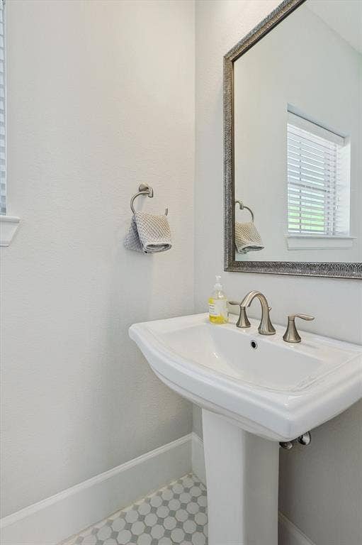 Half bathroom off second floor stairs