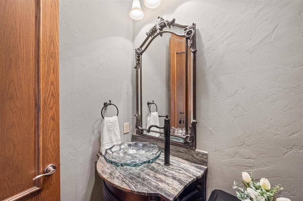 Downstairs half bath conveniently located near living, dining, library.