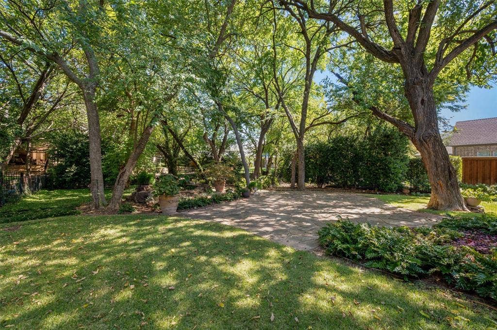 Heritage mature trees offer a shady respite and lush view.