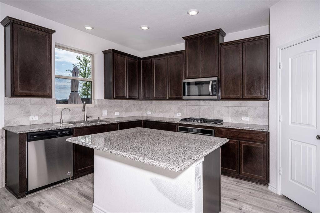 3508 Highland Bayou Drive, Prosper, TX 75078 Spacious Kitchen with Stainless Steel Appliances, Granite Counter Top, Island & Walk-in Pantry