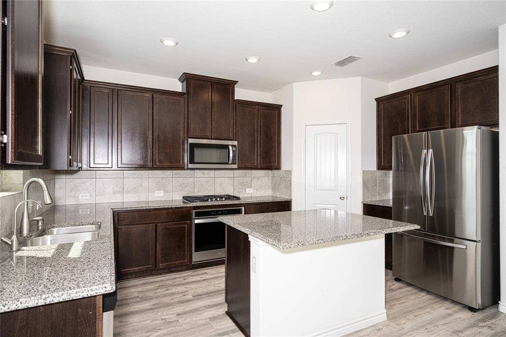 3508 Highland Bayou Drive, Prosper, TX 75078 Spacious Kitchen with Stainless Steel Appliances, Granite Counter Top & Island