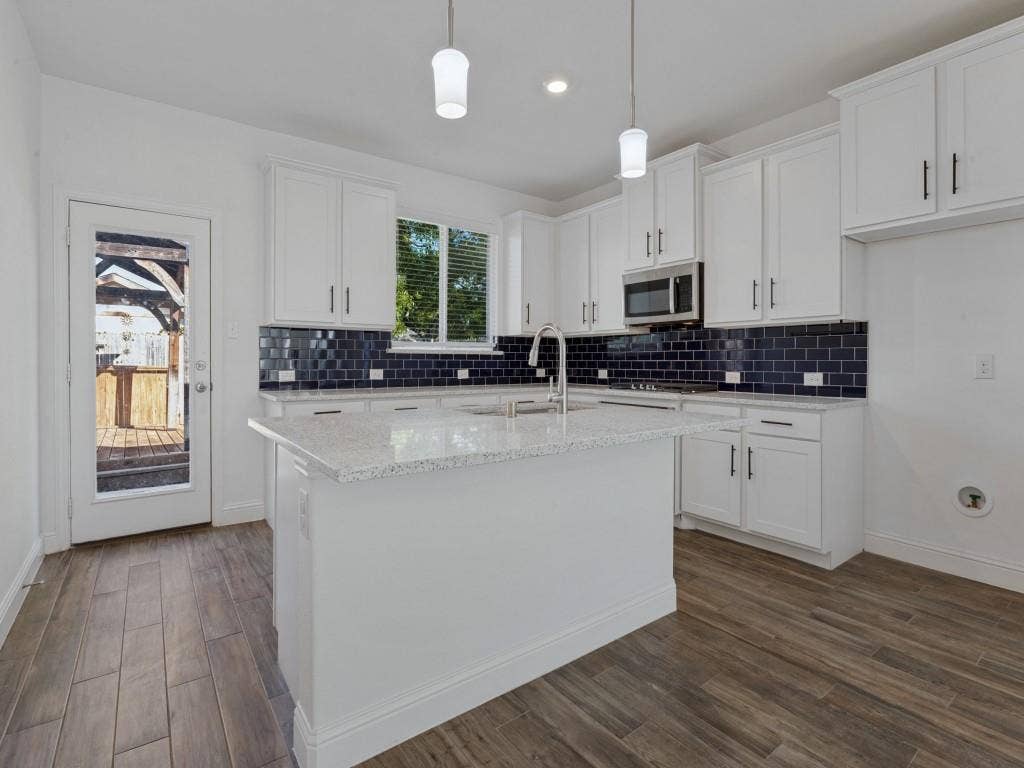 336 Clark Street, Irving, TX 75060 Large kitchen island offers additional workspace and a gathering spot for everyday living and entertaining.