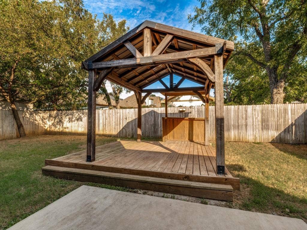 336 Clark Street, Irving, TX 75060 Beautiful wood gazebo with a built-in bar creates an inviting outdoor entertaining space.