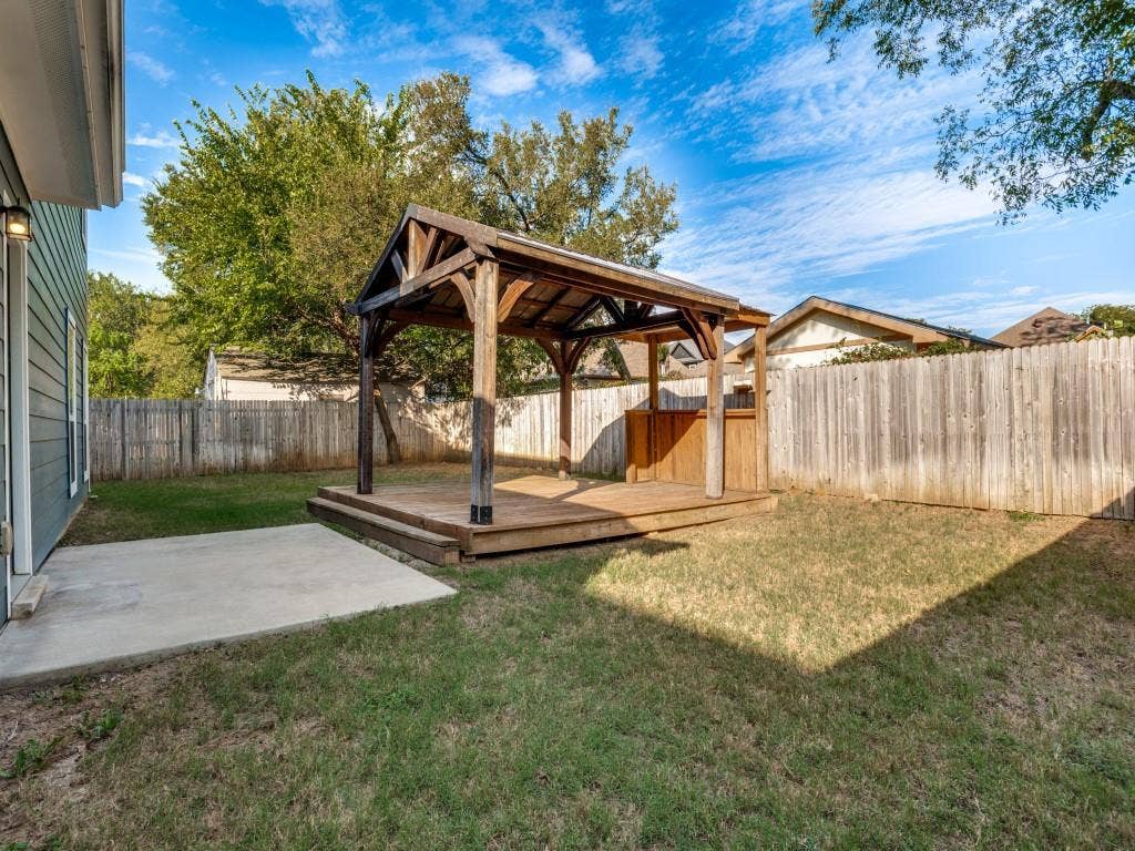 336 Clark Street, Irving, TX 75060 Oversized fenced backyard with a gazebo and plenty of space to relax, play, or entertain.