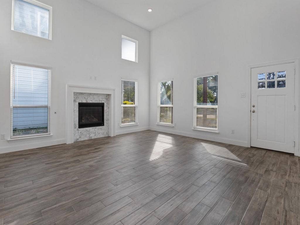 336 Clark Street, Irving, TX 75060 Soaring ceilings, abundant natural light, and a welcoming fireplace highlight the spacious living room