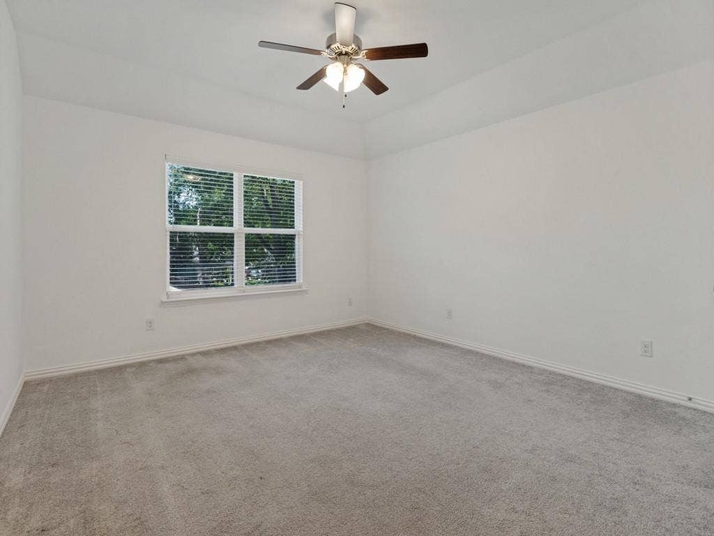 336 Clark Street, Irving, TX 75060 Comfortable bedroom featuring soft carpeting, a ceiling fan, and natural light.