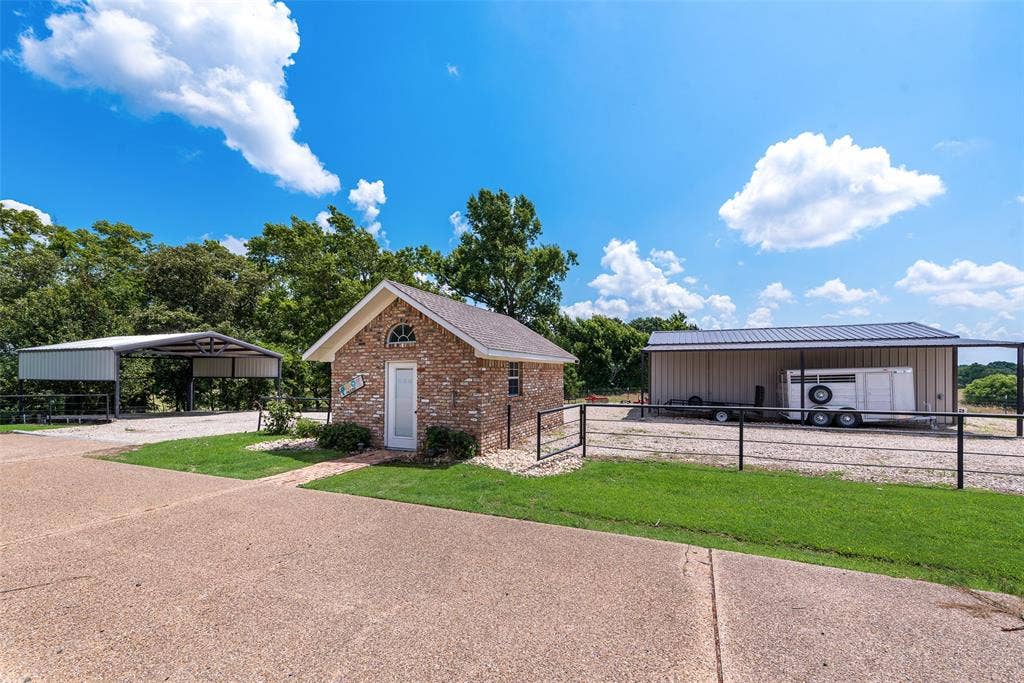 View of pool house and shop