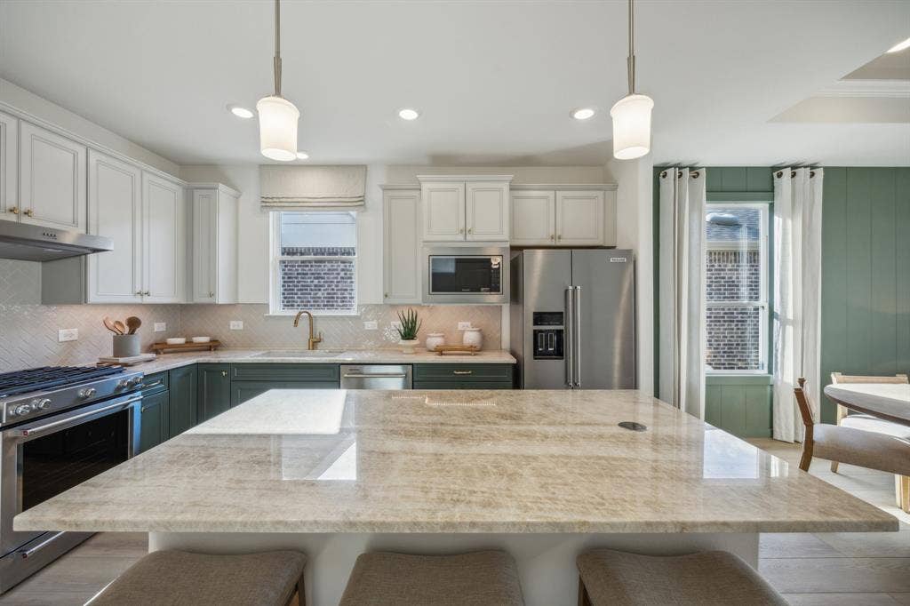 *Model Representation - Spacious kitchen with eat-in bartop island