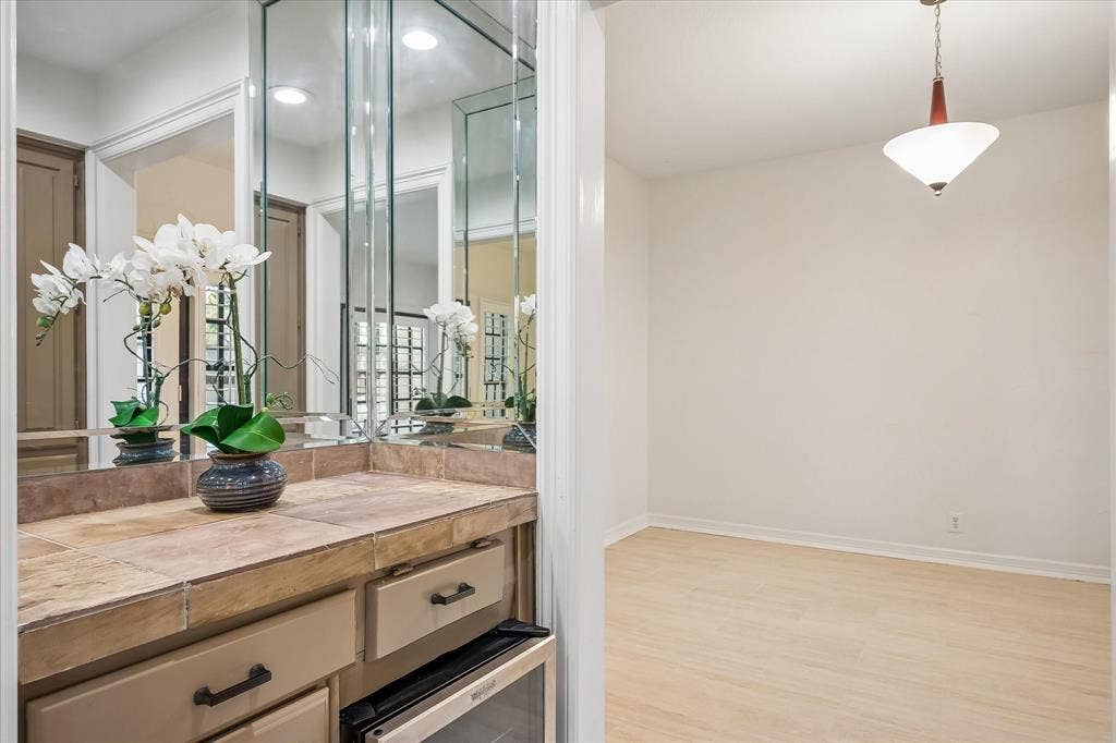 4611 O Connor Court, Irving, TX 75062 Dry Bar features a fridge and cabinetry