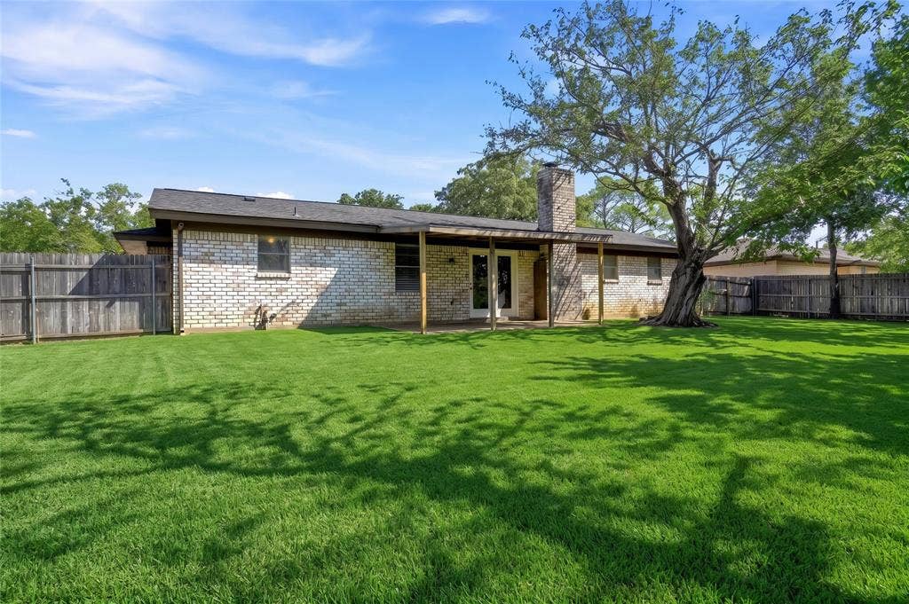 Again, Yard is enhanced. Covered Patio.. LARGE Backyard.. Trees