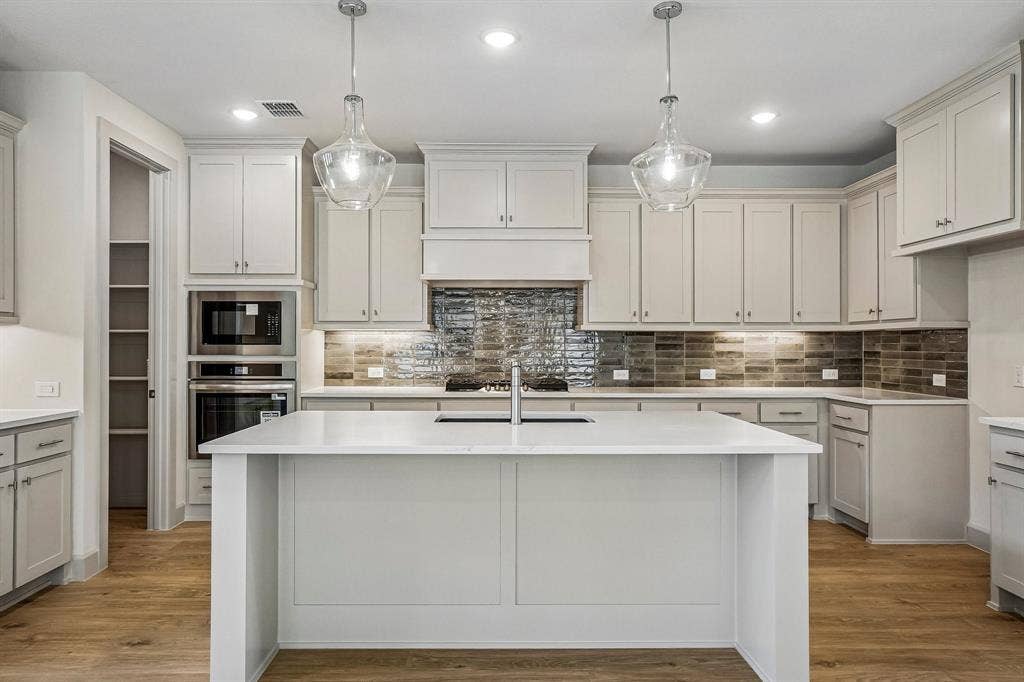 4733 Peary Lane, McKinney, TX 75071 Your spacious kitchen island is the perfect place for friends and family to gather round!