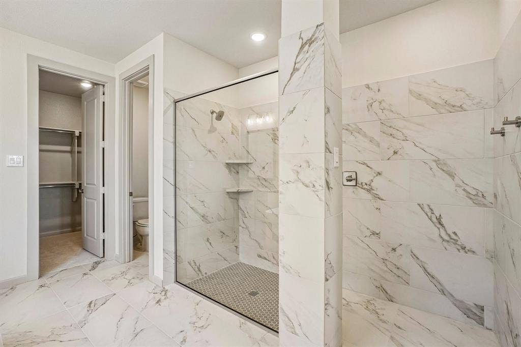 4733 Peary Lane, McKinney, TX 75071 This dream owner's bath features a spacious walk in shower with drying area!