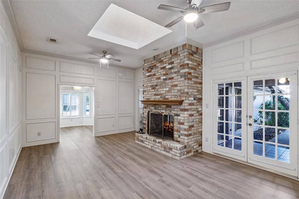 4063 Seabury Drive, Dallas, TX 75287 One of two living areas with a double sided gas fireplace.