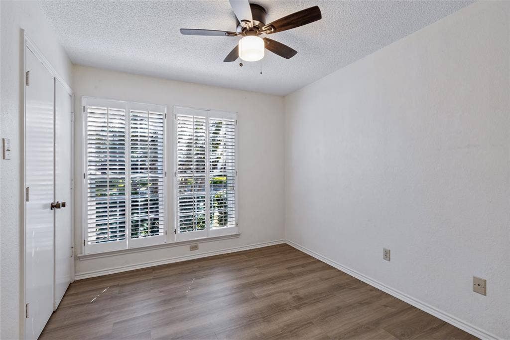 4063 Seabury Drive, Dallas, TX 75287 Secondary bedroom has a nicely sized closet and new ceiling fan.