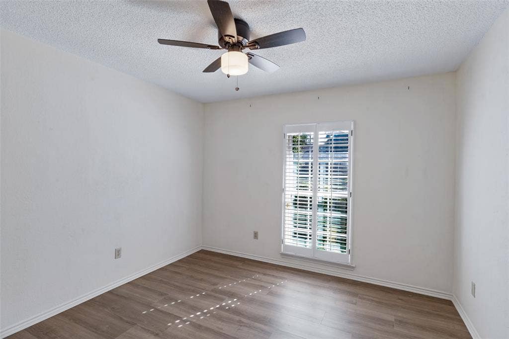 4063 Seabury Drive, Dallas, TX 75287 Secondary Bedroom with natural light, new ceiling fan and closet.