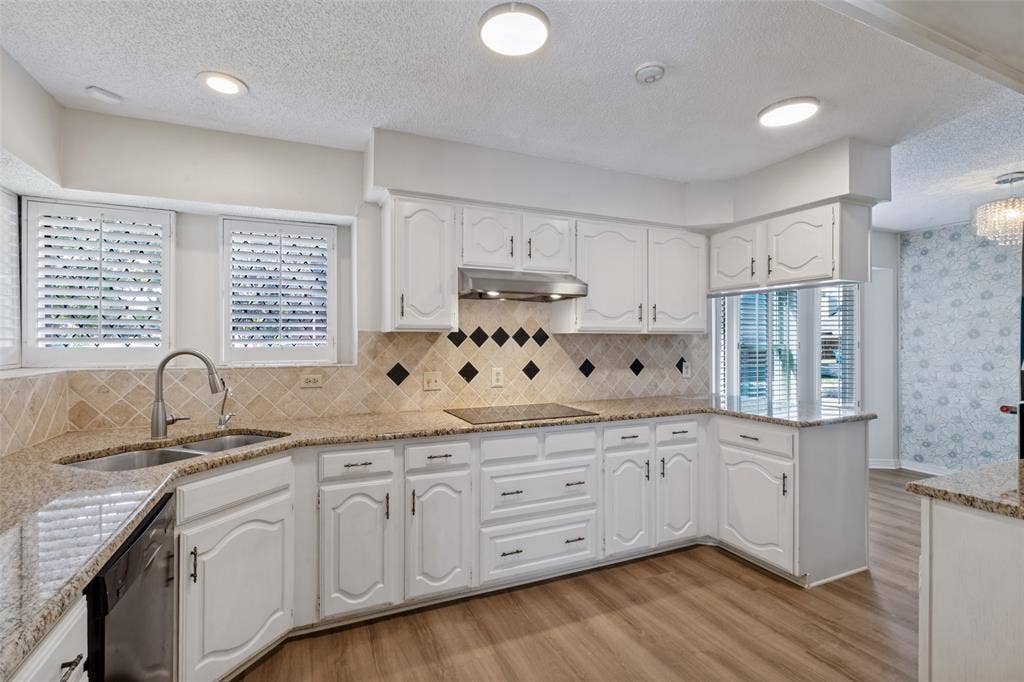 4063 Seabury Drive, Dallas, TX 75287 Kitchen with induction cooktop and Bosch dishwasher has a view from sink area.