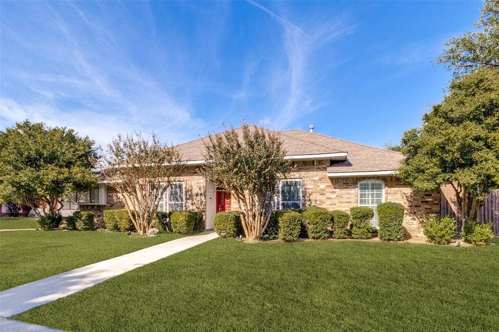 4063 Seabury Drive, Dallas, TX 75287 Almost a quarter acre lot with one neighbor on the side and alley access to the side and back of the home.