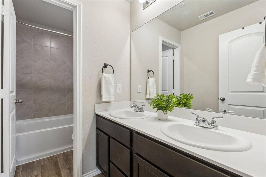 Guest bathroom with duel sinks.