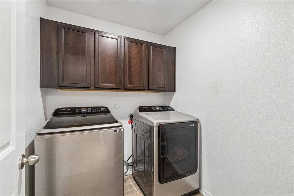 Upstairs laundry room with extra storage