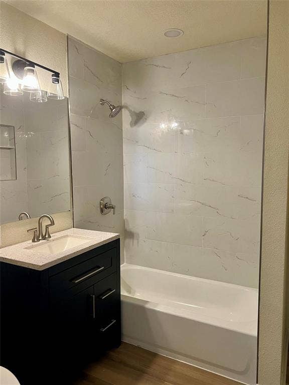 Dark finish vanity featuring a quartz countertop, rectangular drop-in sink, and metallic faucet
