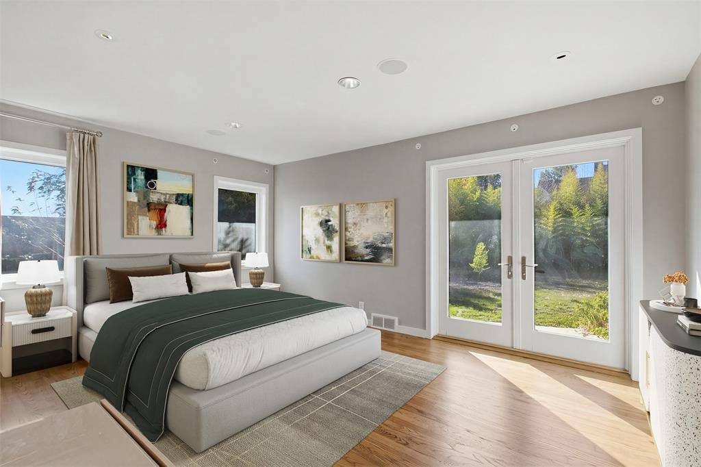 7606 Currin Drive, Dallas, TX 75230 Room featuring wood-finish flooring, recessed lighting, double glass-panel doors, and multiple windows.