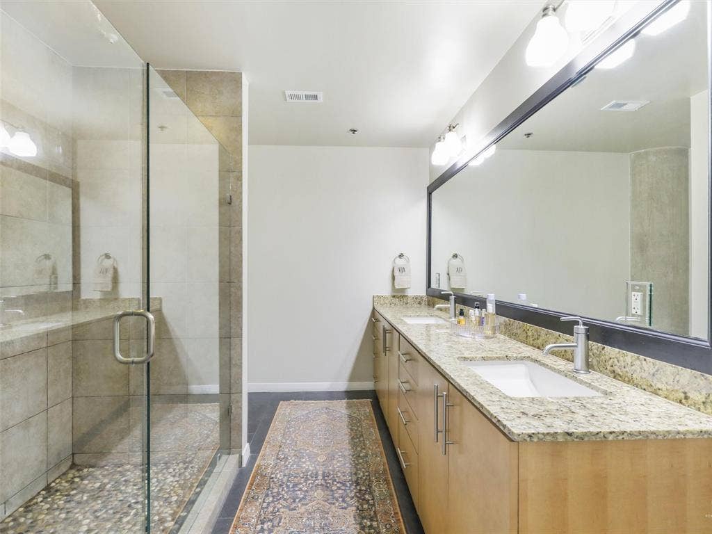 1001 Belleview Street, #307, Dallas, TX 75215 HUGE walk in shower and linen closet are greatfeatures in the primary bathroom