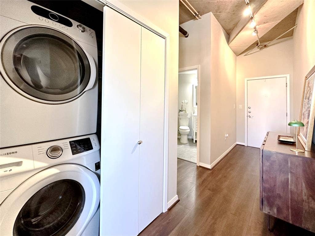 1001 Belleview Street, #307, Dallas, TX 75215 Stacked washer and dryer are located here inaddition to a large pantry with shelving