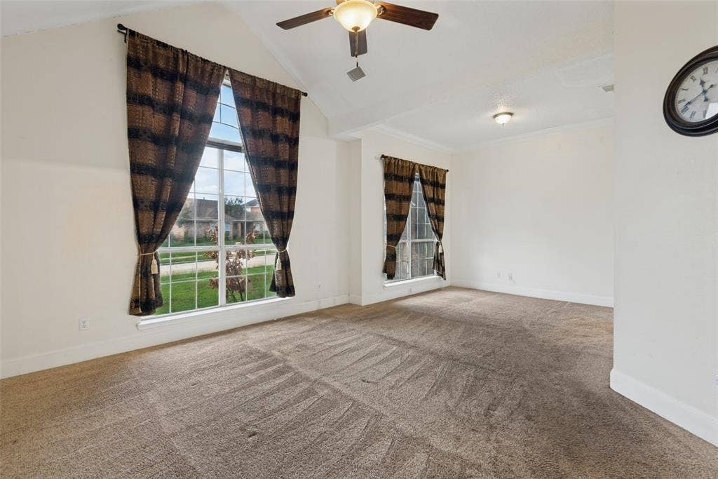 2306 Bent Brook Drive, Mesquite, TX 75181 Vaulted ceilings, large grid windows, and a ceiling fan with integrated lighting