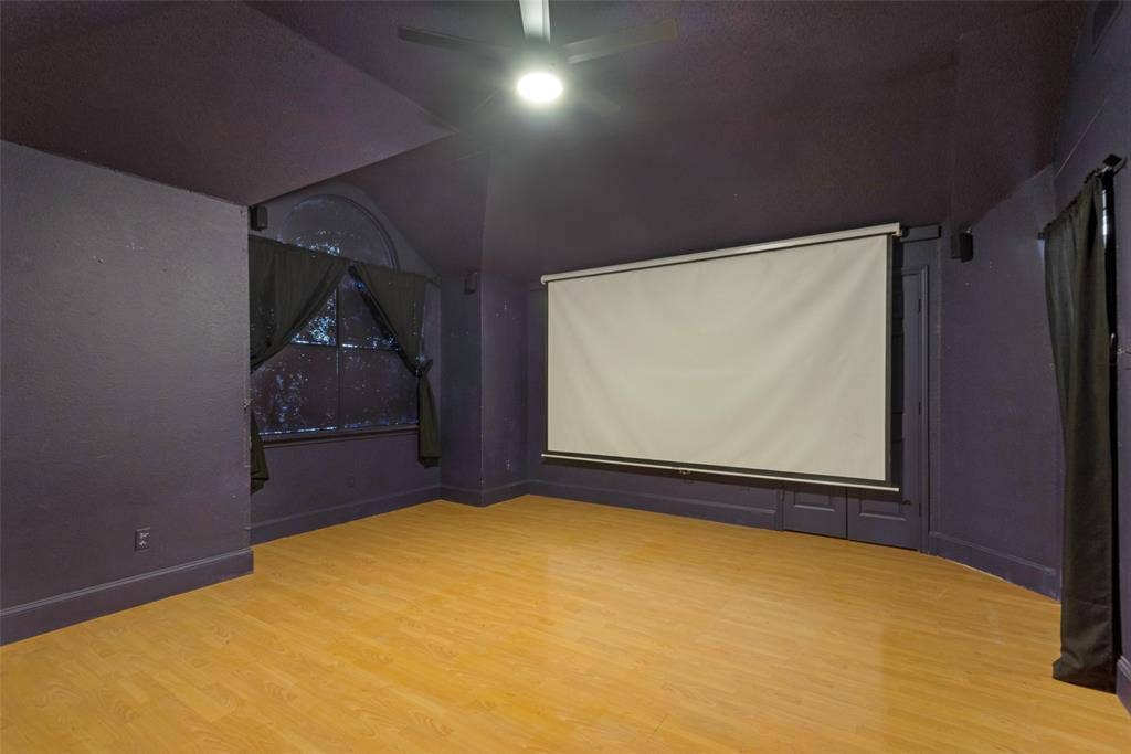 2306 Bent Brook Drive, Mesquite, TX 75181 Vaulted ceilings with an integrated ceiling fan, wood-finish flooring, and a mounted projection screen
