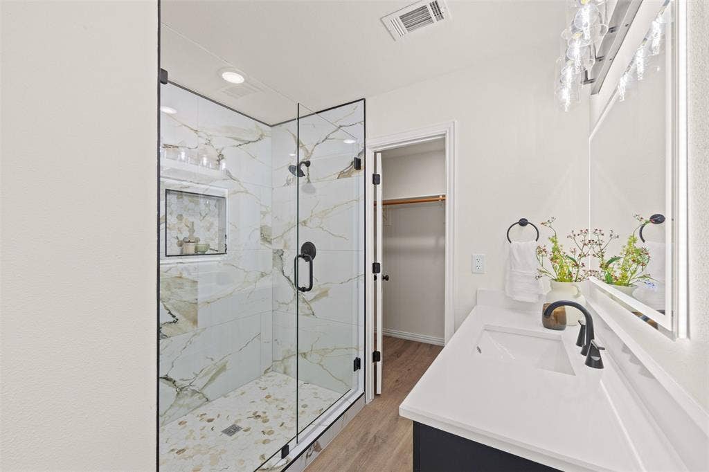 5860 Newt Patterson Road, Mansfield, TX 76063 Primary bathroom with dual vanity and stand alone shower