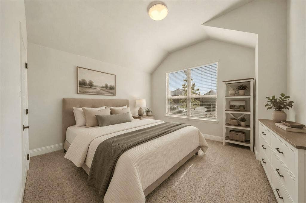 Vaulted ceilings, neutral carpeting, and a double-pane window with horizontal blinds