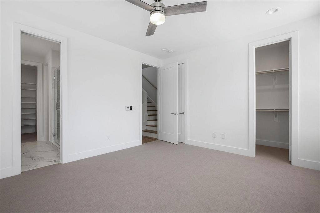 4904 Lexington Court, Dallas, TX 75206 Neutral carpeting, integrated ceiling fan with light fixture, recessed lighting, and dual entries leading to a walk-in closet and en-suite
