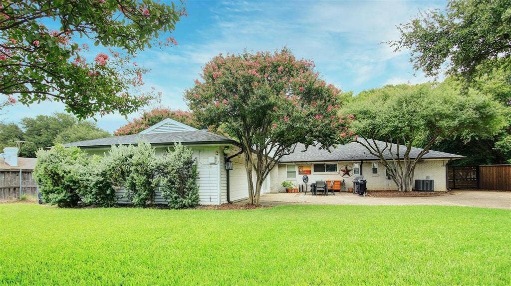 3230 Camelot Drive, Dallas, TX 75229 Enjoy this expansive private backyard offering serene views of the patio and secured front driveway entrance. Backyard is surrounded by mature trees, lush maintenance free landscaping. This lot has plenty of space for a pool, outdoor kitchen and so much more. Your pets will love all the space.