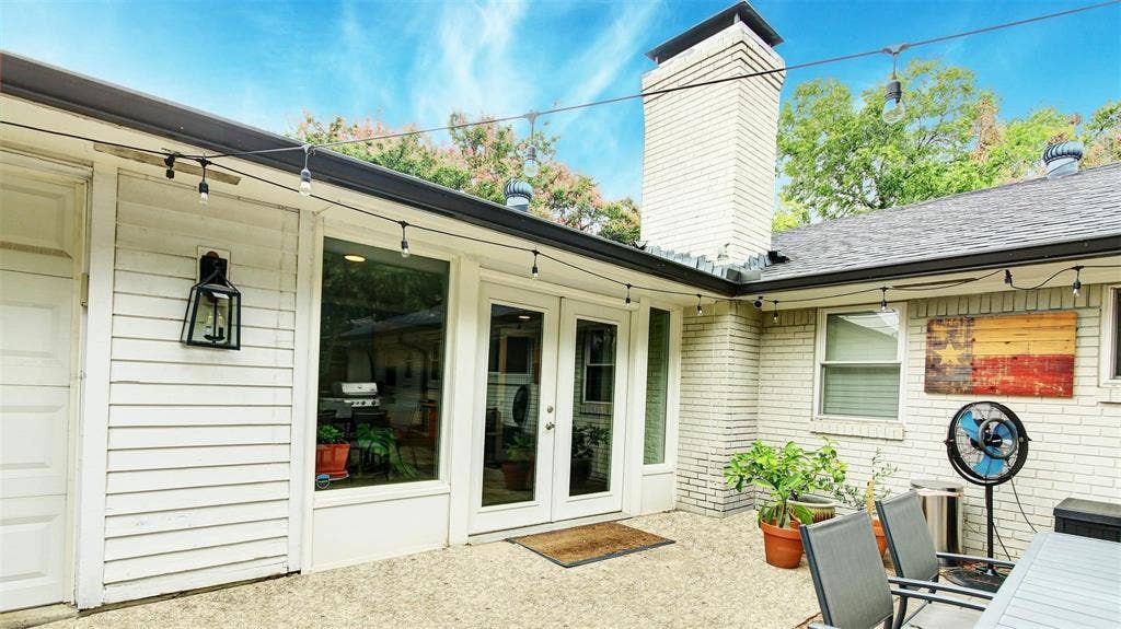 3230 Camelot Drive, Dallas, TX 75229 Patio is conveniently located of the sunroom and is big enough area for a good size patio table, chairs, grill, etc