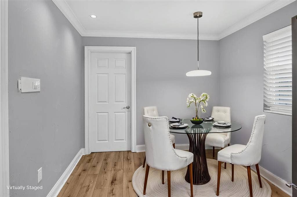 3230 Camelot Drive, Dallas, TX 75229 Breakfast area is 9 x 7 with wood look vinyl floors, window and access door to the full size Utility room and inside garage entrance. Updated light fixture