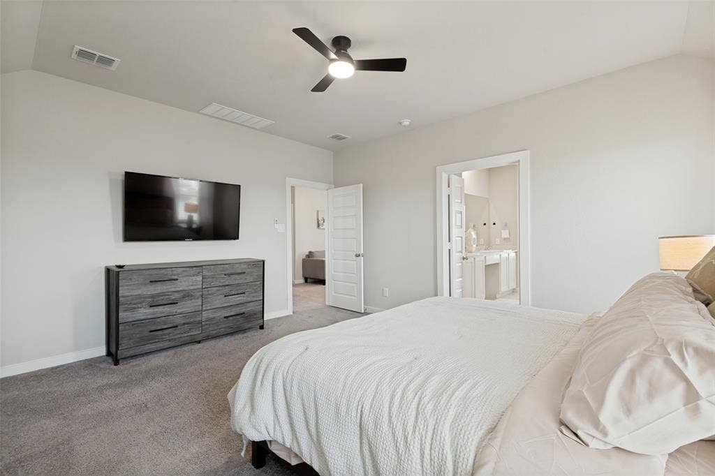 2808 Spring Side Drive, Royse City, TX 75189 Vaulted ceilings with a central ceiling fan, neutral wall finishes, and solid-core interior doors