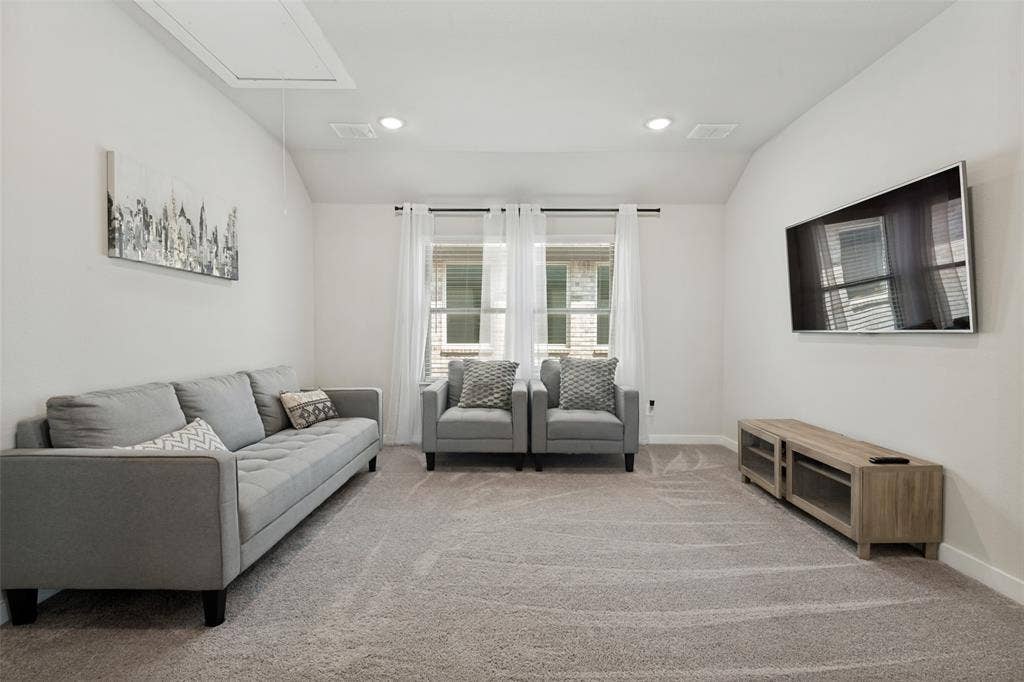 2808 Spring Side Drive, Royse City, TX 75189 Neutral-toned interior featuring a vaulted ceiling, recessed lighting, and wall-to-wall carpeting