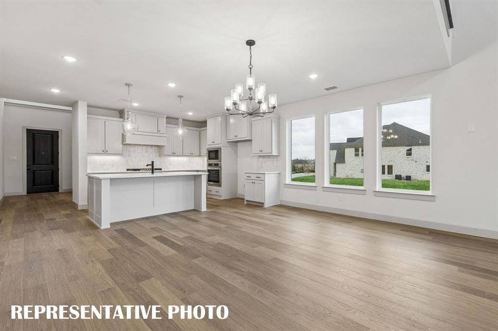 4520 Sunfish Lane, McKinney, TX 75071 Offering a light filled, open and flowing design, our Toulouse II plan is an entertainer's dream home! REPRESENTATIVE PHOTO