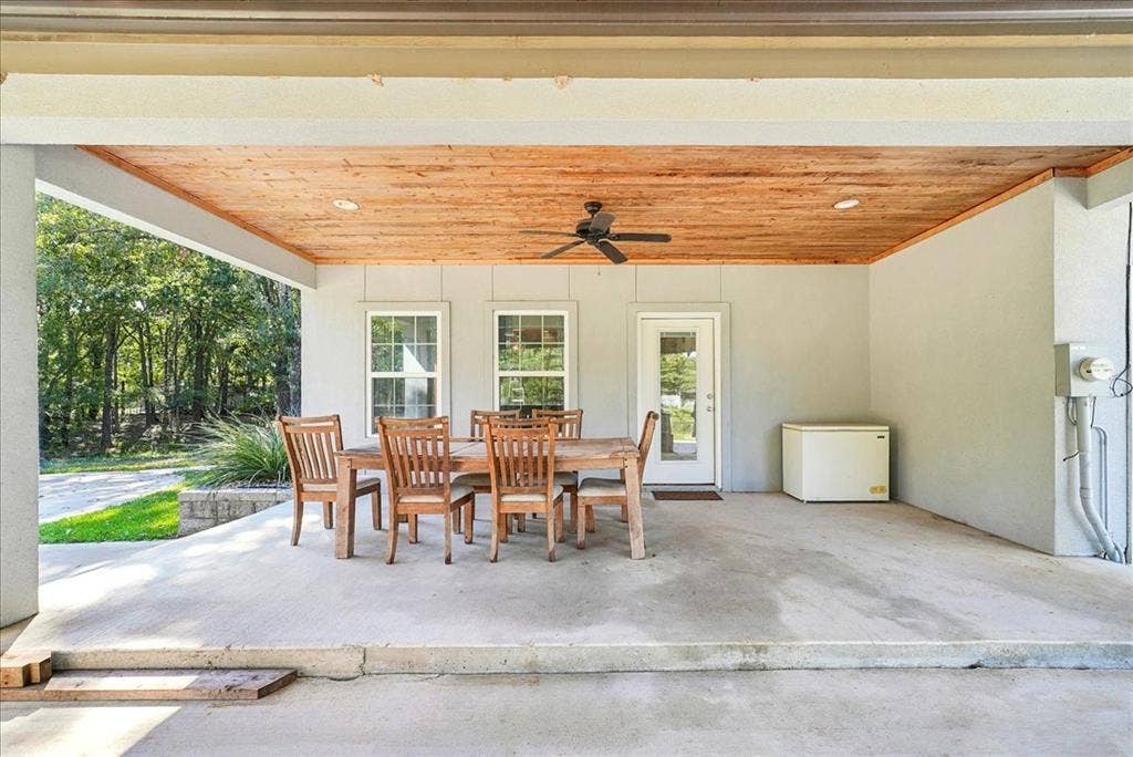 7320 County Road 3512, Quinlan, TX 75474 Covered patio featuring a wood-plank ceiling, ceiling fan, recessed lighting, and concrete flooring