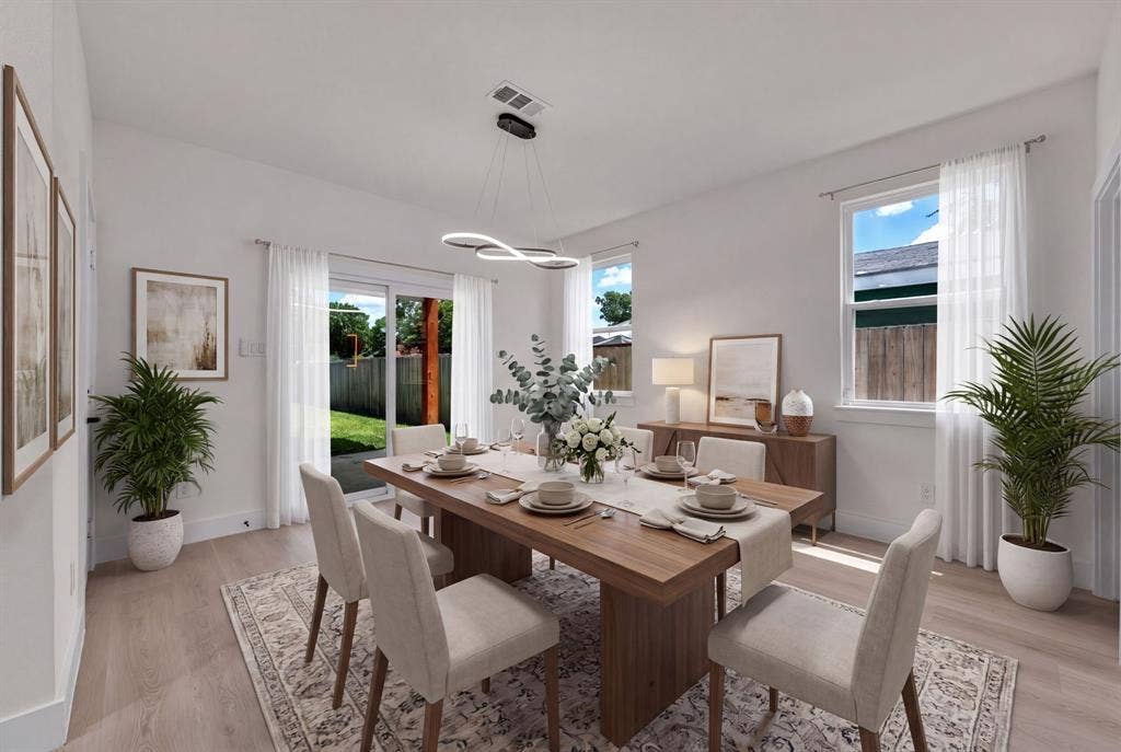 3639 Pueblo Street, Dallas, TX 75212 Dining area featuring wood-finish flooring, sliding glass door, and modern sculptural chandelier