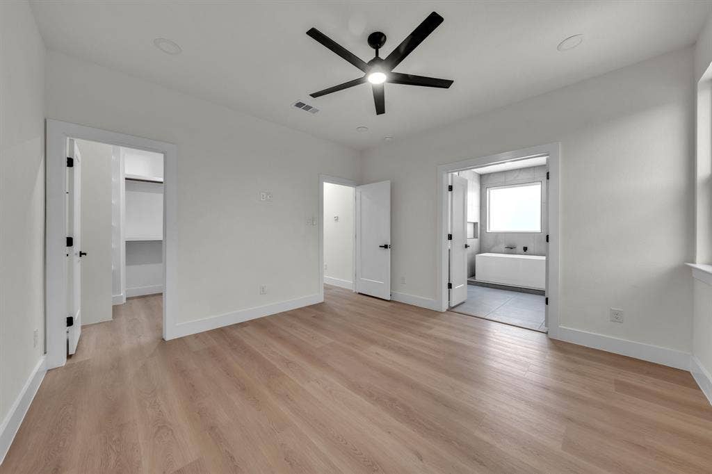 3639 Pueblo Street, Dallas, TX 75212 Neutral interior space featuring wood-finish flooring, recessed lighting, and a multi-blade ceiling fan with integrated lighting
