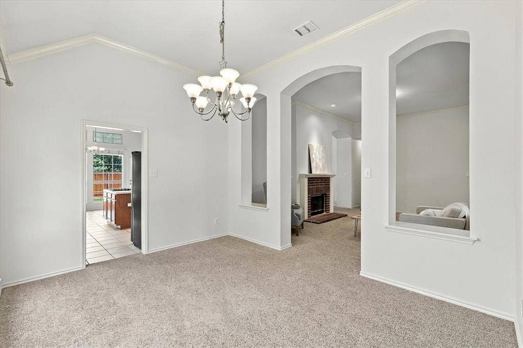 Dining room features high ceilings, natural light and flows to formal living and kitchen.