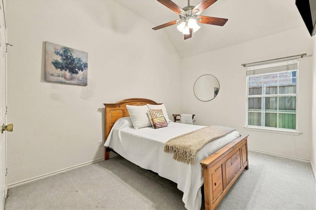 Spare bedroom with queen size bed.