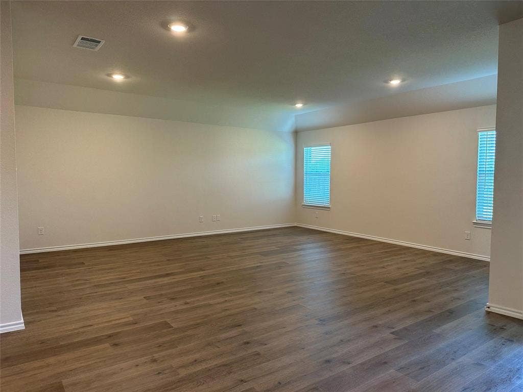 219 Greenshade, Caddo Mills, TX 75135 Spare room with dark wood-style floors and recessed lighting
